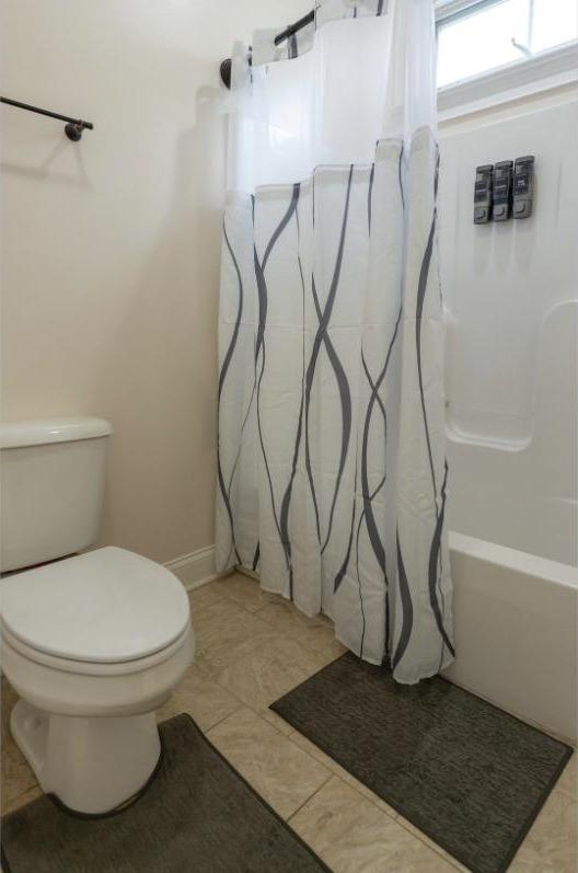 Full bathroom with a shower/tub combo