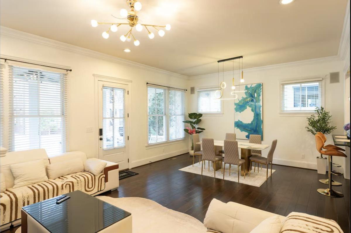 Bright living and dining space with access to the rear patio