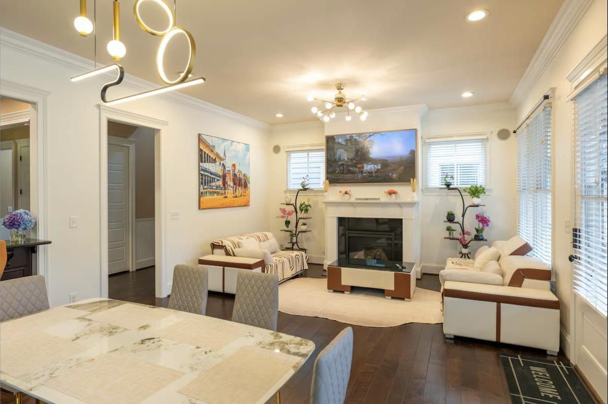 Open-concept living and dining area with gas fireplace