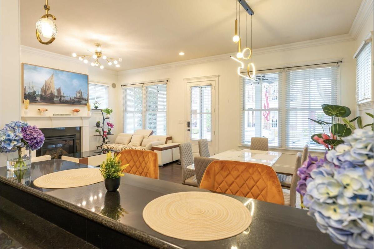 Open-concept layout connecting the kitchen, dining, and living areas